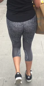 Sexy girl walking in grey patterned leggings with friend in tight jeans