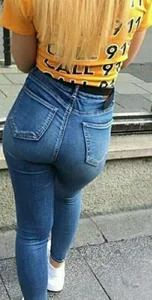 A few girls with tight asses in jeans waiting for