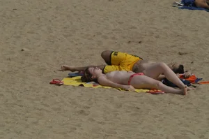Topless girls on a beach in Barcelona
