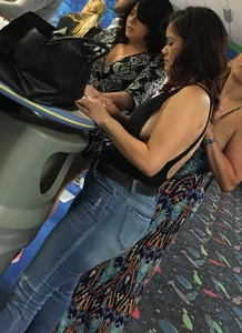 Thick brunette in tight jeans and showing some side boob