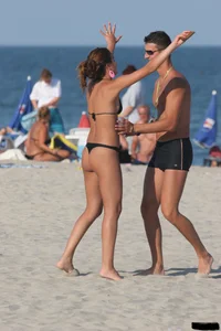 A bunch of sexy beach voyeur babes in bikinis, thongs and topless