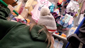 Babe in green hoodie looking for items