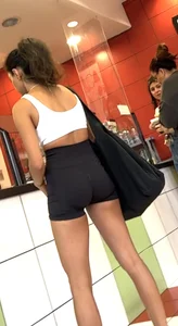 hot petite Indian chick showing some T&A in skimpy workout clothes