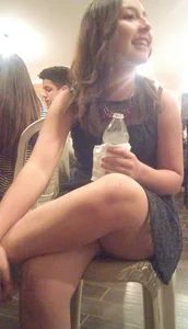Cute College Girl Sitting With Crossed Legs