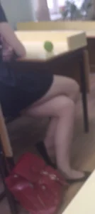Candid College Girl Sitting With Crossed Legs in Class, Feet in Flats
