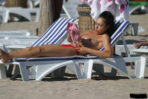 Beach voyeur girls in bikinis, thongs and topless