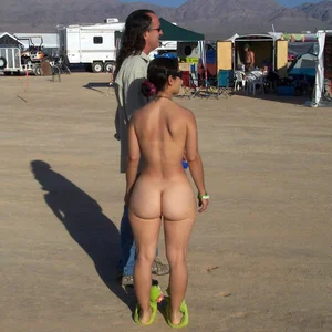 Only one is nude - group photos where only 1 girl is naked, and the rest of the people are dressed