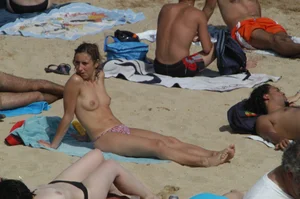 Topless girls on a beach in Barcelona