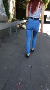 Redhead with a nice ass in tight jeans walking