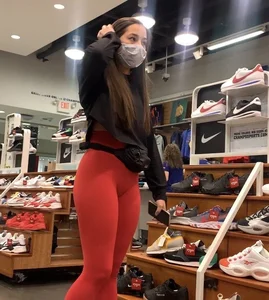 Adorable college babe shopping in tight red leggings