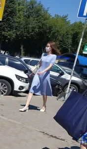 Cute Girl in a Blue Dress and High Heeled Shoes Walking Down the Street Candid Pic