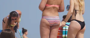 Two thick white girls in bikinis on the beach with big asses