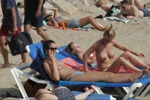 Girls on a nude beach in Sitges, Spain