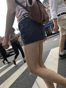 Young Girl in Shorts And Sandals Crossing the Street Gallery