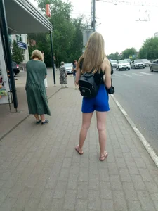 Girl in Shorts and Sandals with Hot Legs Standing on a Bus Stop City Candyd