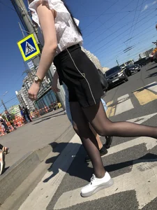 Skinny candid teen wearing shorts and black pantyhose crossing the street