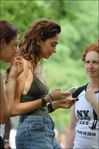 Gymnast or yoga girl in the park in shorts and no bra and even showing some pussy