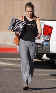 Sexy girl in the parking lot in tight grey sweatpants