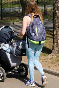 Sweet young milf wearing leggings walking in a park street creepshot
