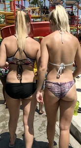 Two sexy blondes at a water park with nice asses in bikinis