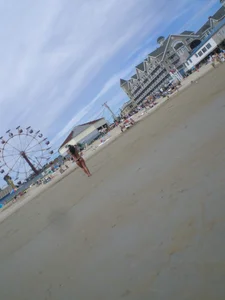 Milf laying out on a beach in Maine in her little thong