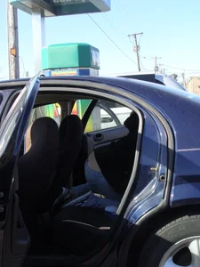 Girls cleaning their cars in jeans and pants