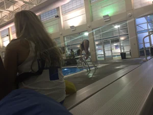 Girl preparing to jump into the pool