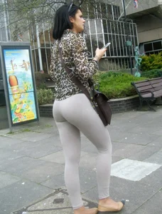 Brunette lady with a nice ass in light grey leggings walking