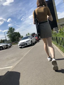 Candid Girl in a Skirt With Very Thin Hot Legs Walking on a Street Creepshots