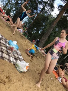 Girls in One-Piece Body Swimsuits Running Towards Water and Swimming - Beach Photo Gallery