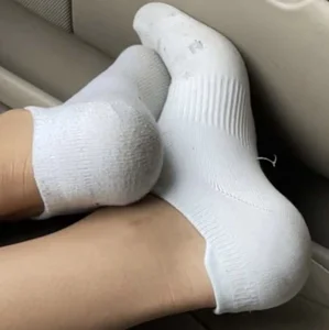 Hot girlfriend's photos sitting on the grass and in the car - closeups of her feet in socks and her ass in panties and shorts