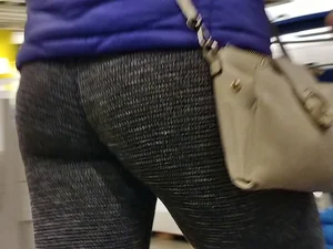 Blonde lady shopping in tight dark grey leggings
