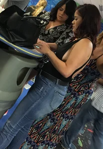 Thick brunette in tight jeans and showing some side boob