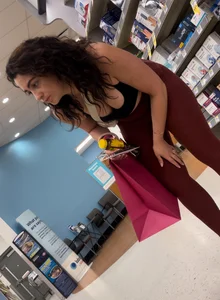 Cute girl in maroon leggings w cleavage