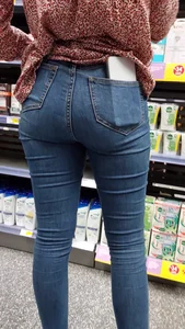 Brunette girl with nice ass sexy PAWG in tight jeans in a store