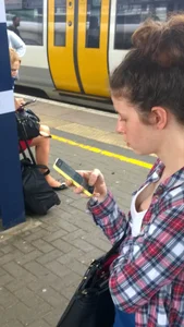 Cute girl on a tram stop