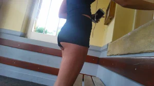 Hot brunette showing her ass cheeks in tiny shorts