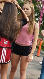 Bunch of skinny teens in shorts at the fun fair