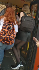 Teen in a Leather Skirt with Thin Legs in Black Pantyhose Getting on the Bus Candid