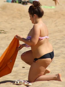 Thick girl on the beach with big boobs and a big booty