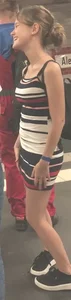 Cute skinny girl in a short dress subway photos
