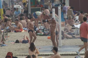 Topless girls on a beach in Barcelona