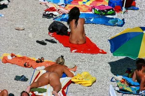 Ula FKK Sexy brunette on a nude beach topless, bottomless and with blue thong