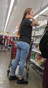 Girl with tattoos in tight jeans