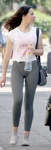 Brunette girl in grey leggings showing her mound, slight camel toe and gap