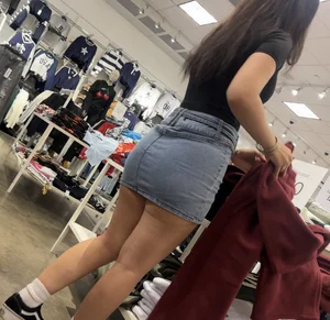 Cute salesgirl with tight Jean skirt showing some legs (OC)