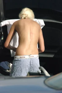 Blonde babe changing into and out of bikini and shows her tits