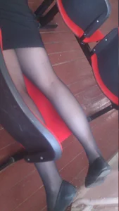 College Girl Lying on the Chair in Black Pantyhose and Flats