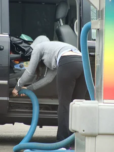 Girls cleaning their cars in jeans and pants