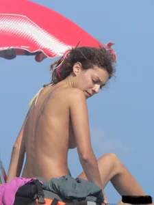 Sexy girls going topless at the beach showing off their sexy bodies